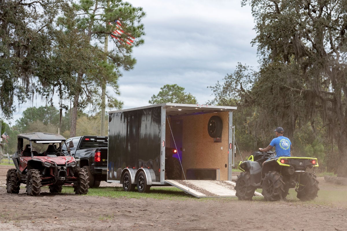 Four Wheeler Backing Out Of Parked Enclosed Xpress 8.5 Wide ATV Trailer